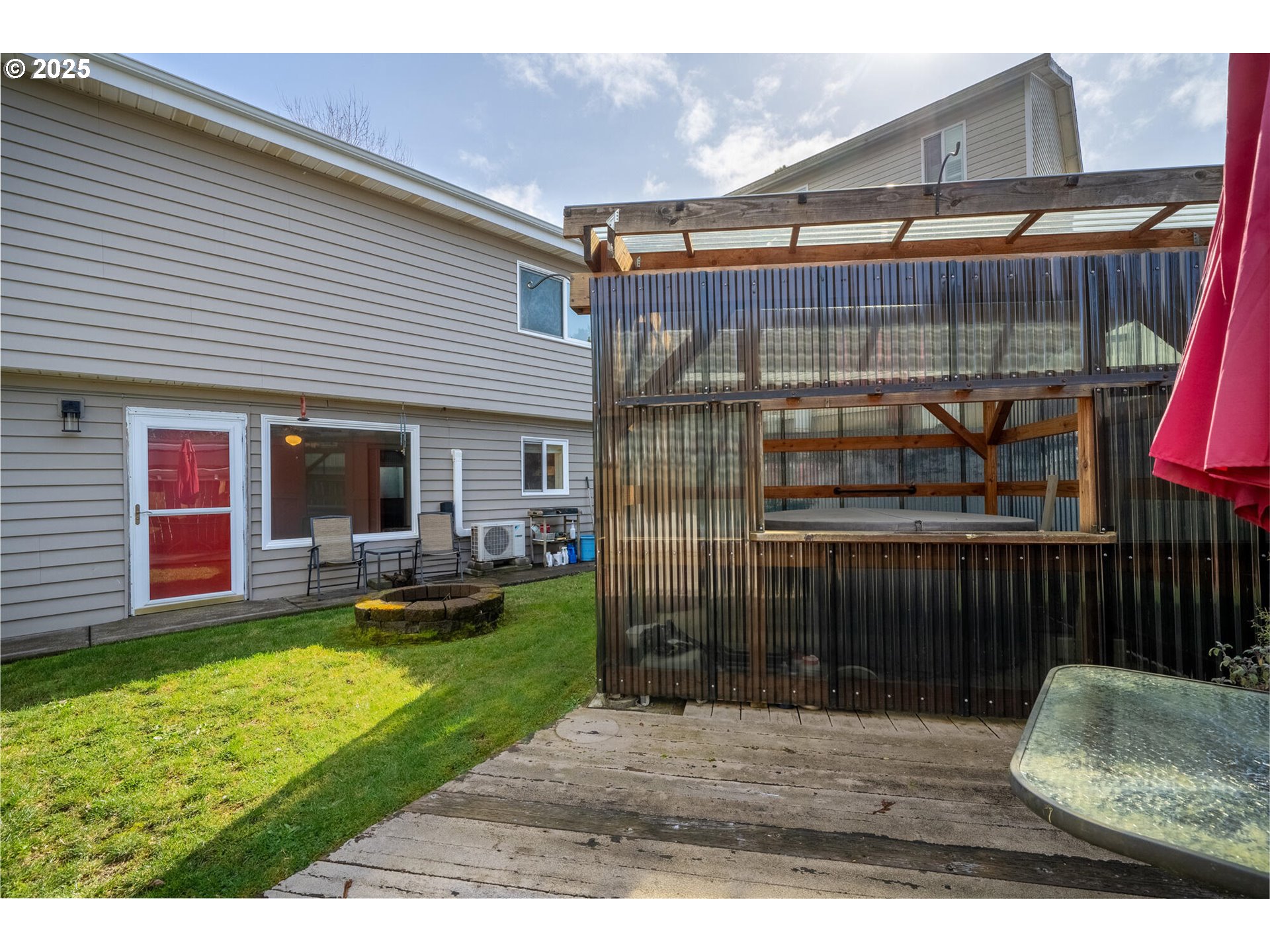109 4th Street Garibaldi, OR 97118 - Photo 37 of 48 a view of a house with a yard and furniture