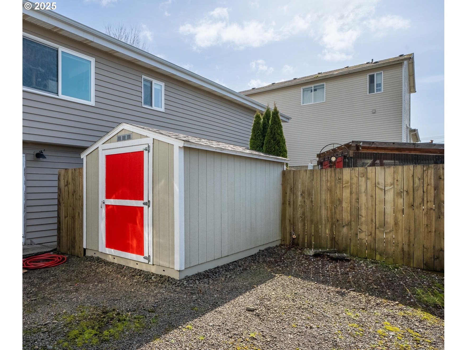 109 4th Street Garibaldi, OR 97118 - Photo 38 of 48 a backyard view with a wooden fence