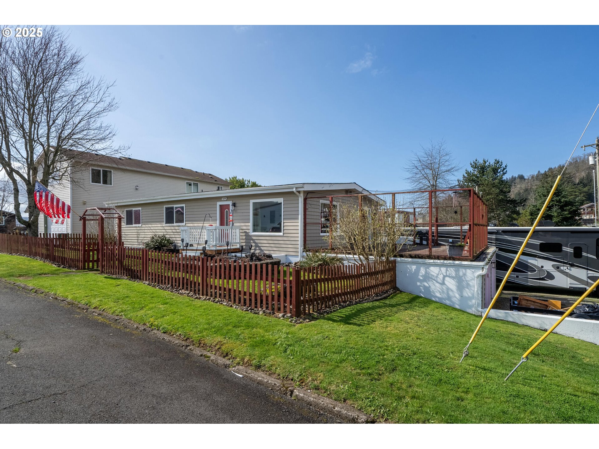 109 4th Street Garibaldi, OR 97118 - Photo 41 of 48 a view of a house with backyard and porch