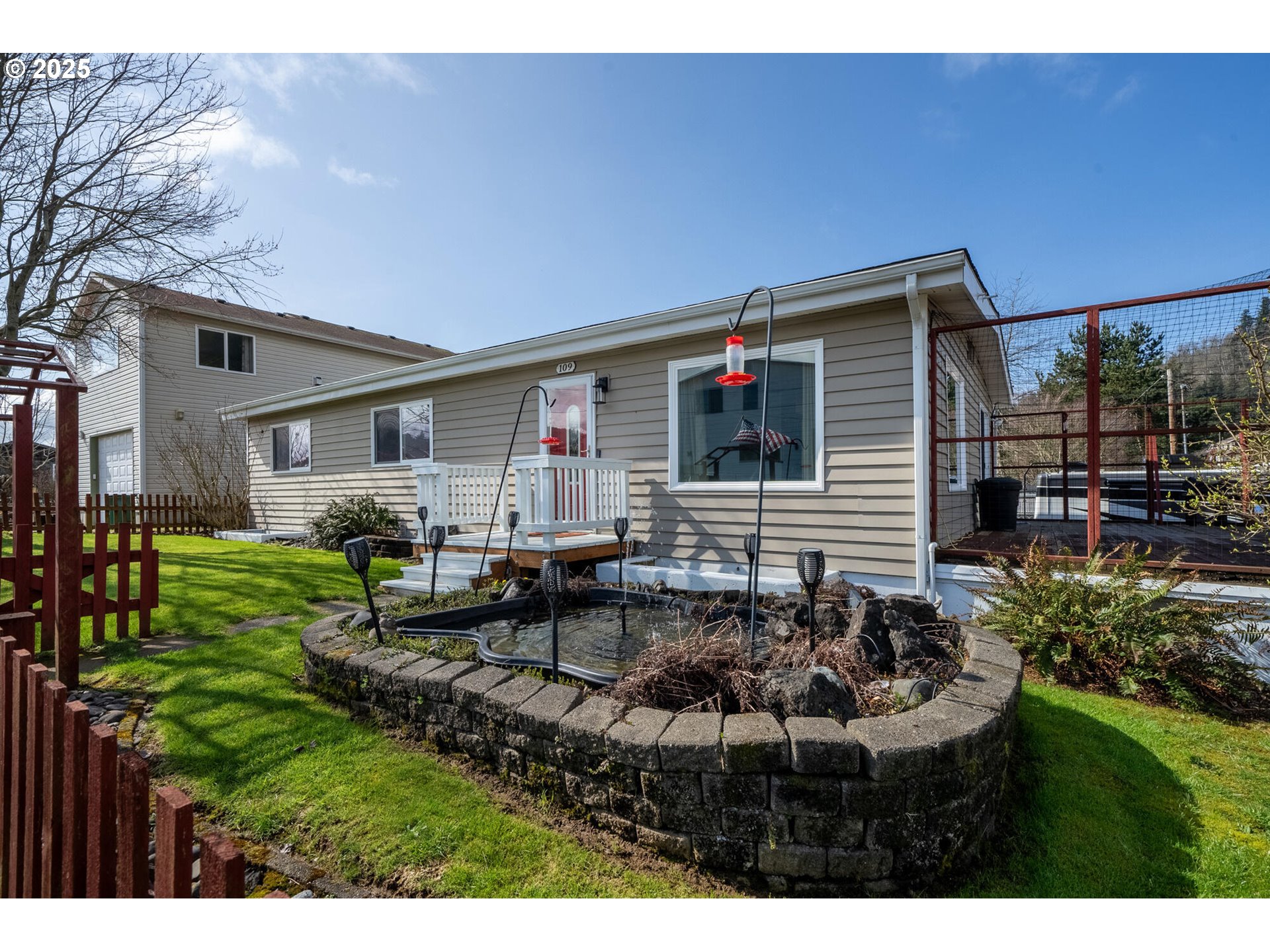 109 4th Street Garibaldi, OR 97118 - Photo 43 of 48 a backyard of a house with garden barbeque oven and yard
