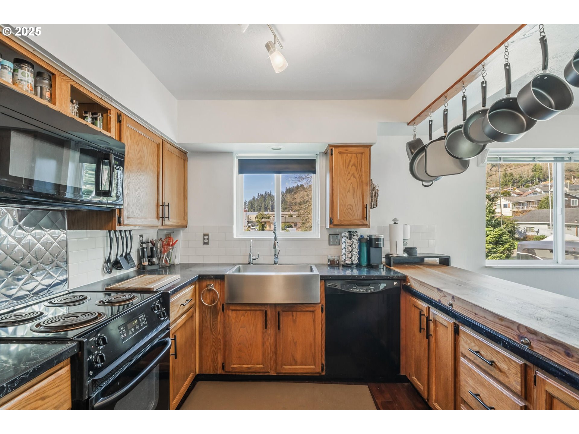 109 4th Street Garibaldi, OR 97118 - Photo 6 of 48 a kitchen with a sink and a stove