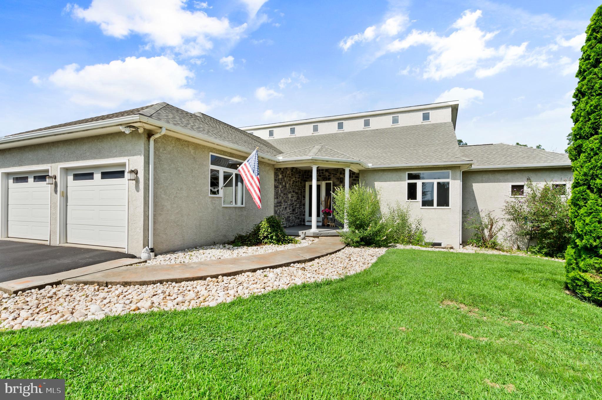 213 Cross Road Gilbertsville, PA 19525 - Photo 1 of 75 a front view of a house with a yard