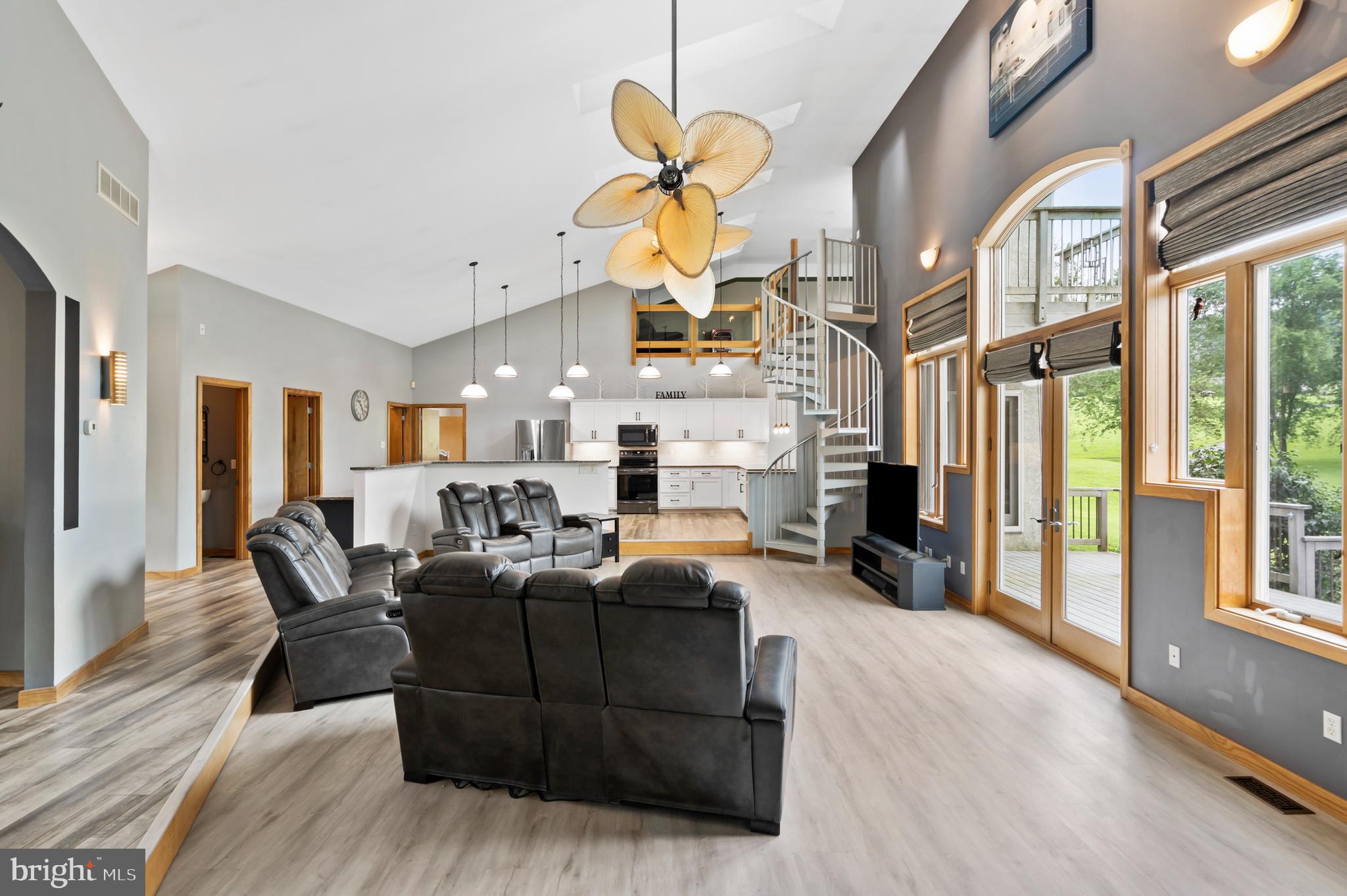 213 Cross Road Gilbertsville, PA 19525 - Photo 11 of 75 a living room with furniture a fireplace and a chandelier