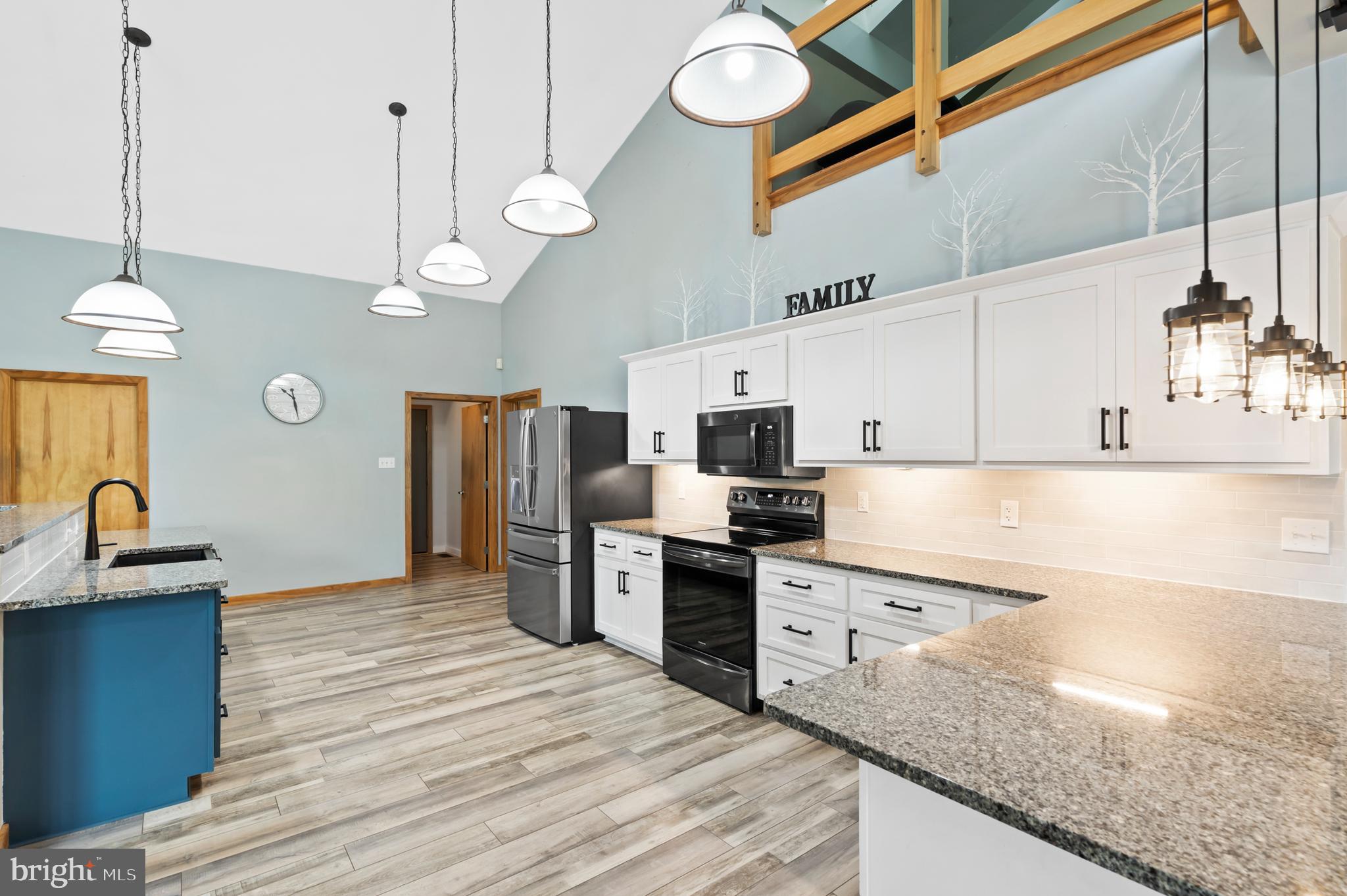 213 Cross Road Gilbertsville, PA 19525 - Photo 17 of 75 a kitchen with stainless steel appliances granite countertop a sink a stove and refrigerator