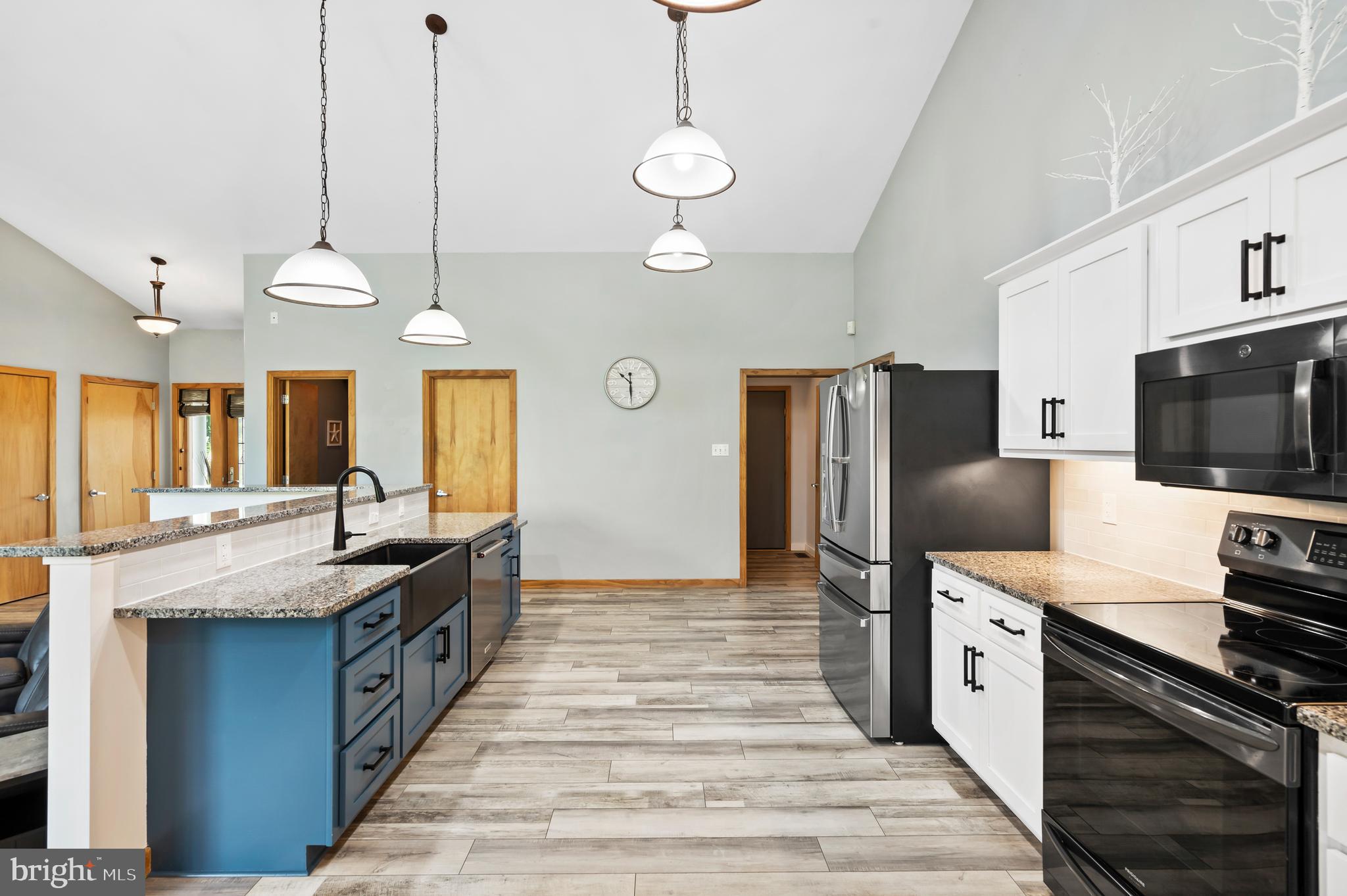 213 Cross Road Gilbertsville, PA 19525 - Photo 18 of 75 a kitchen with stainless steel appliances granite countertop a stove a sink and a refrigerator