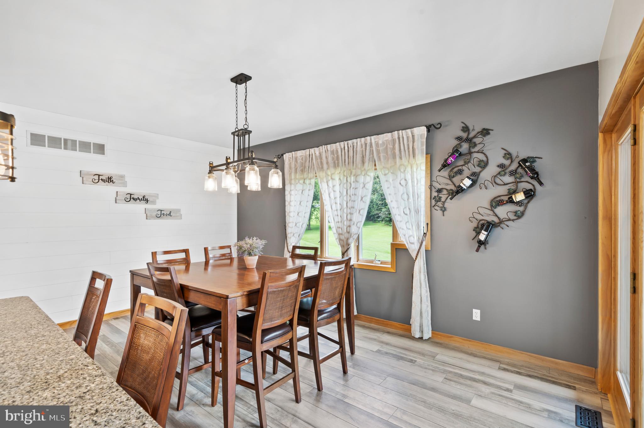213 Cross Road Gilbertsville, PA 19525 - Photo 21 of 75 a dining room with furniture a chandelier and wooden floor