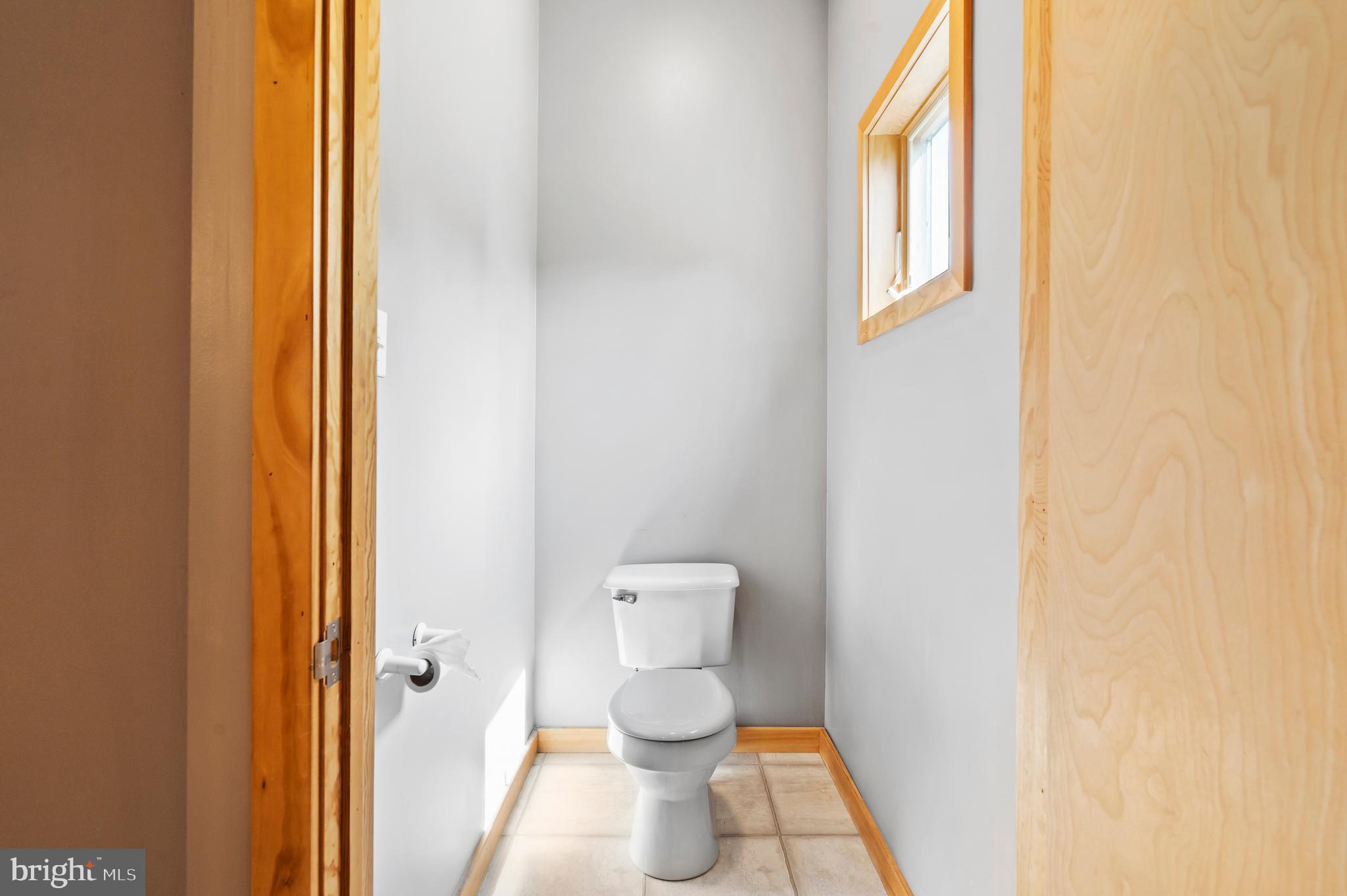 213 Cross Road Gilbertsville, PA 19525 - Photo 32 of 75 a bathroom with a toilet and a shower curtain