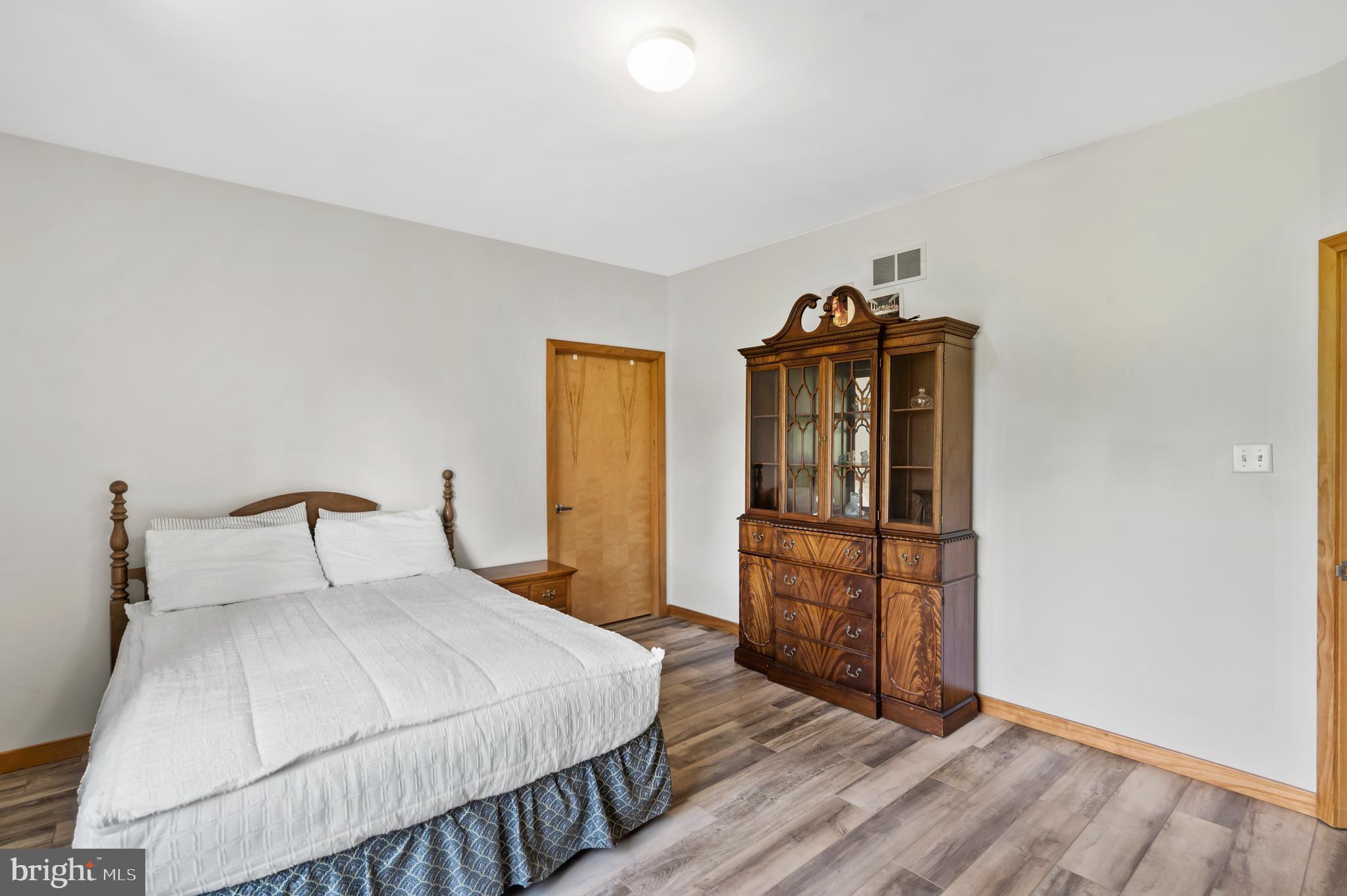 213 Cross Road Gilbertsville, PA 19525 - Photo 38 of 75 a bedroom with a bed and a dresser