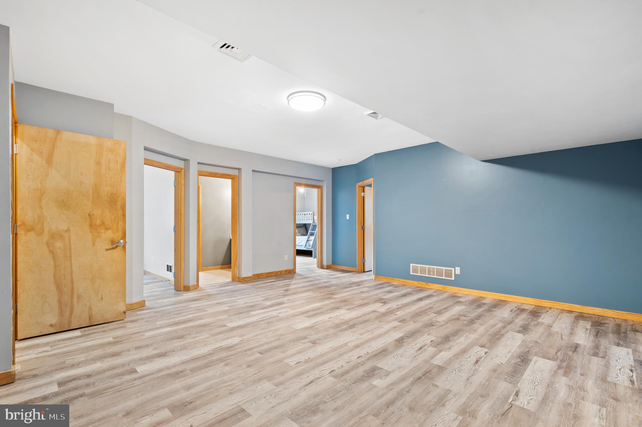 213 Cross Road Gilbertsville, PA 19525 - Photo 44 of 75 a view of an empty room with window and wooden floor