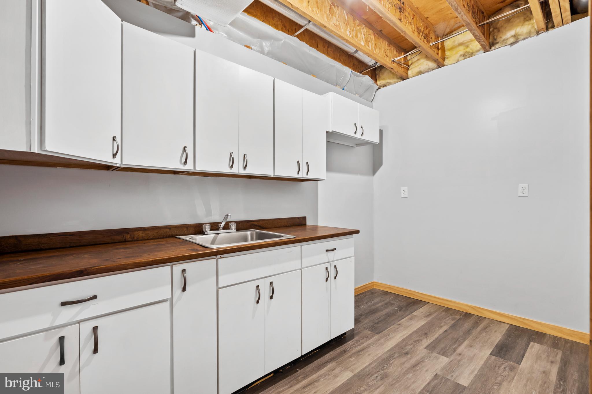 213 Cross Road Gilbertsville, PA 19525 - Photo 49 of 75 a kitchen with granite countertop white cabinets and a stove
