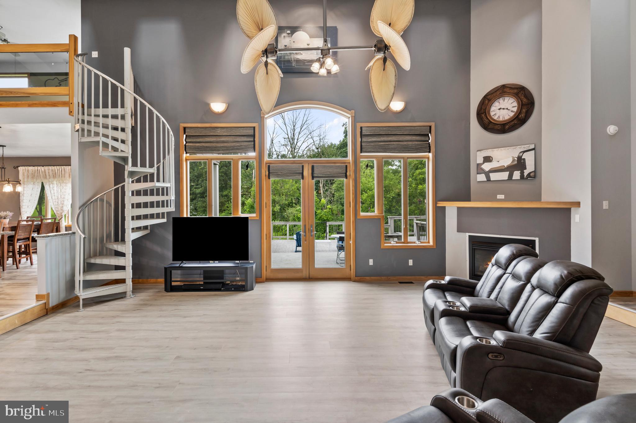 213 Cross Road Gilbertsville, PA 19525 - Photo 6 of 75 a living room with furniture a large window and a flat screen tv