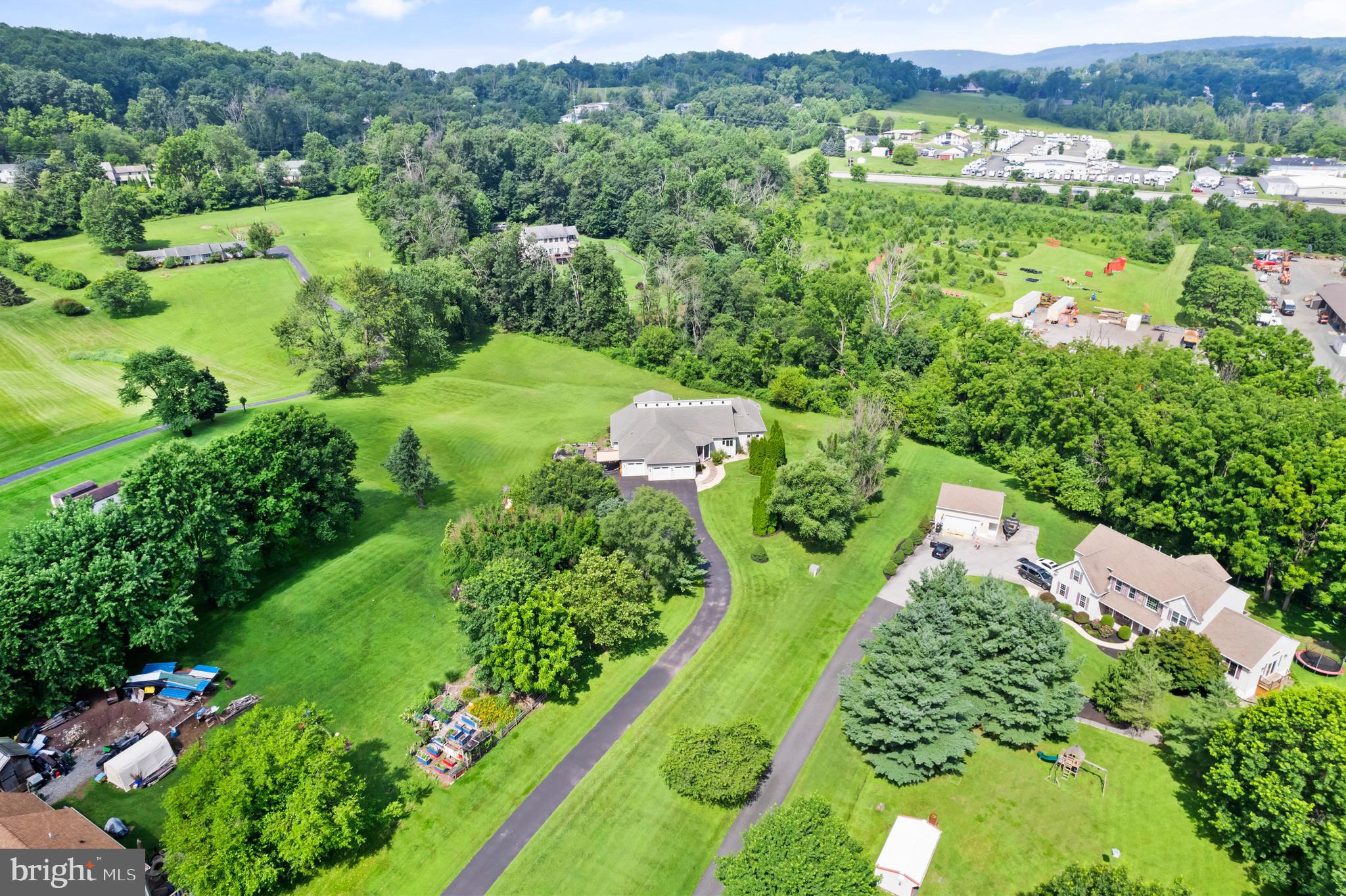 213 Cross Road Gilbertsville, PA 19525 - Photo 73 of 75 an aerial view of green landscape with trees houses and mountain view