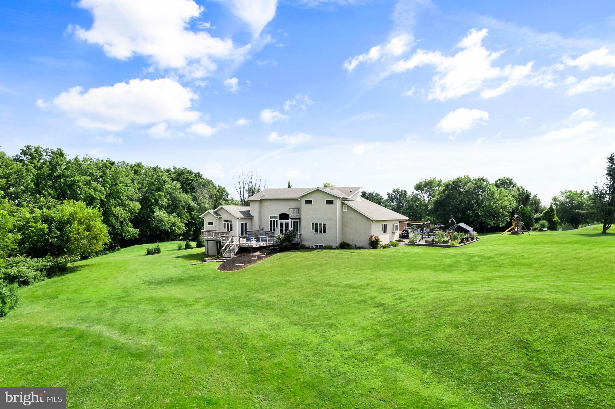 213 Cross Road Gilbertsville, PA 19525 - Photo 75 of 75 a view of a house with a big yard and large trees