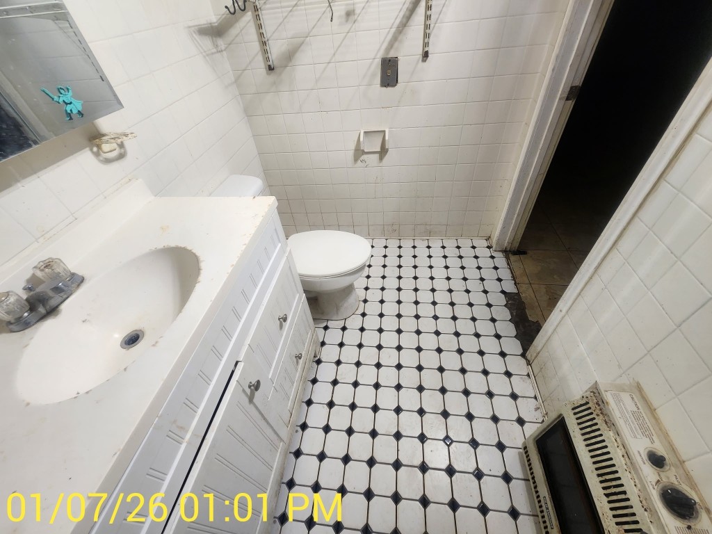 230 Kansas Street Bacliff, TX 77518 - Photo 15 of 16 a bathroom with a sink toilet and shower