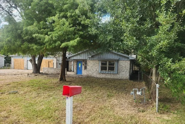 a front view of a house with yard