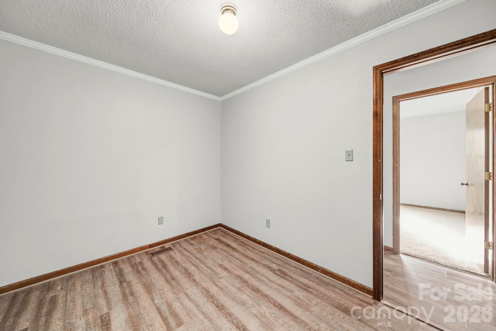 102 Roxie Lane Belmont, NC 28012 - Photo 16 of 26 a view of empty room with wooden floor