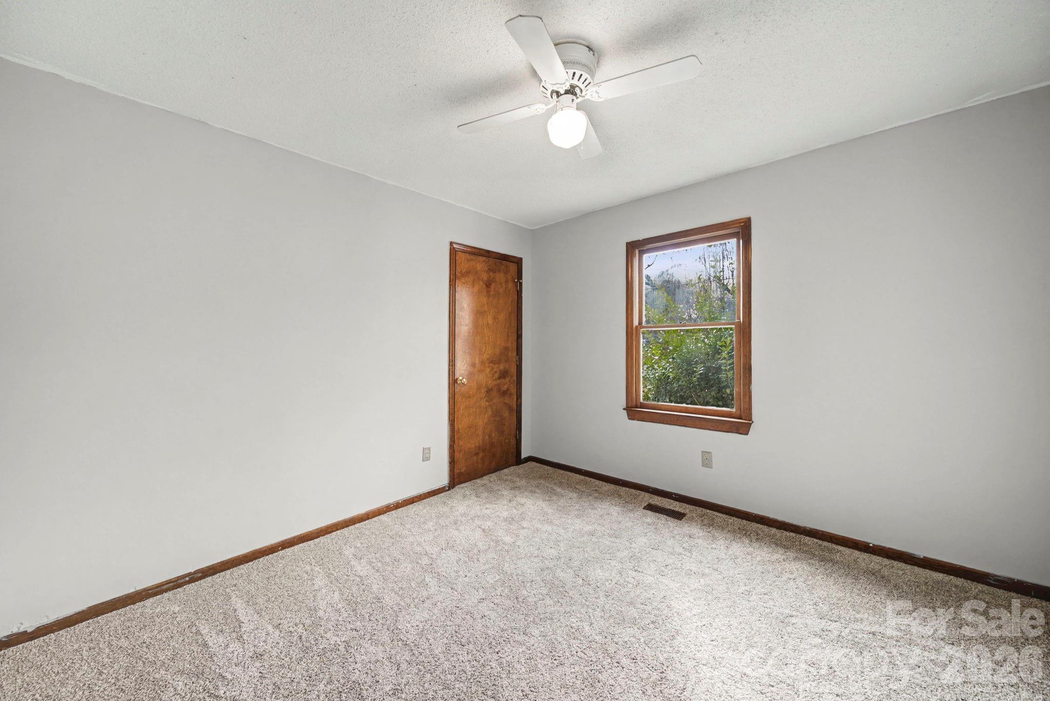 102 Roxie Lane Belmont, NC 28012 - Photo 17 of 26 an empty room with windows and ceiling fan