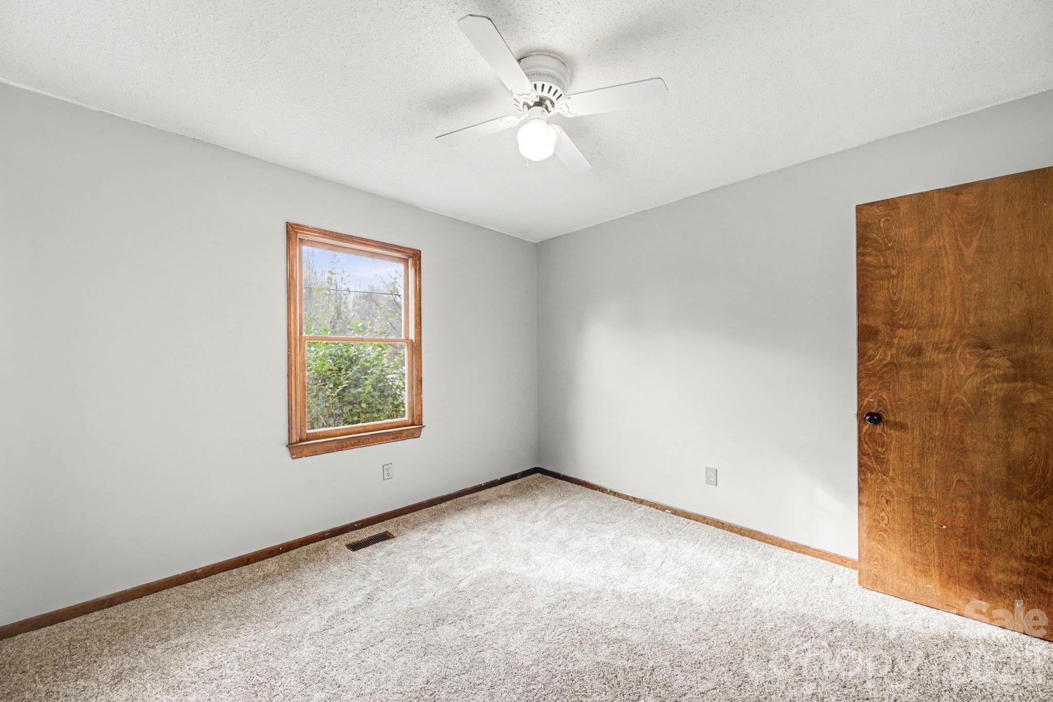102 Roxie Lane Belmont, NC 28012 - Photo 18 of 26 an empty room with windows and fan