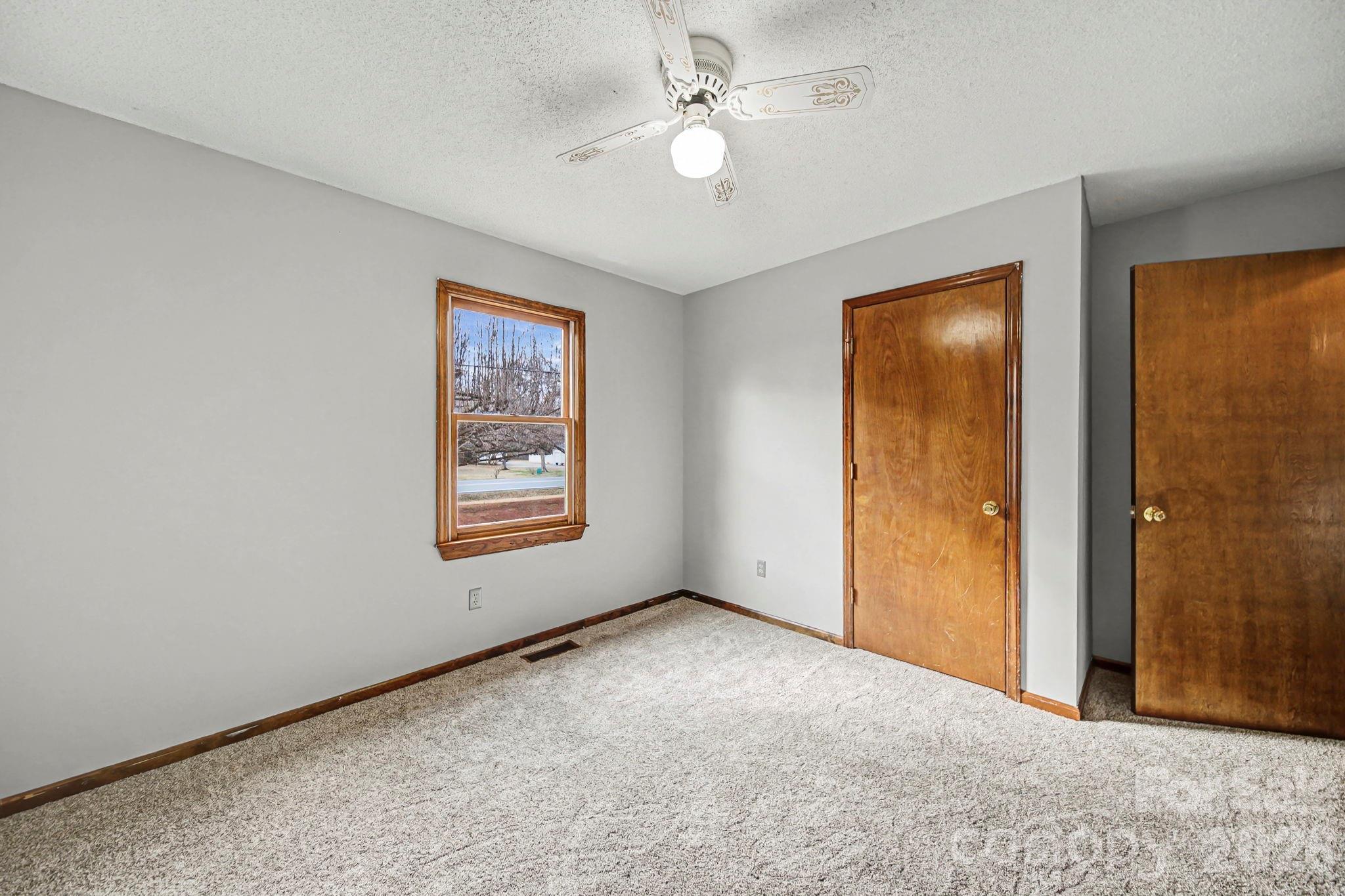 102 Roxie Lane Belmont, NC 28012 - Photo 19 of 26 an empty room with windows and fan