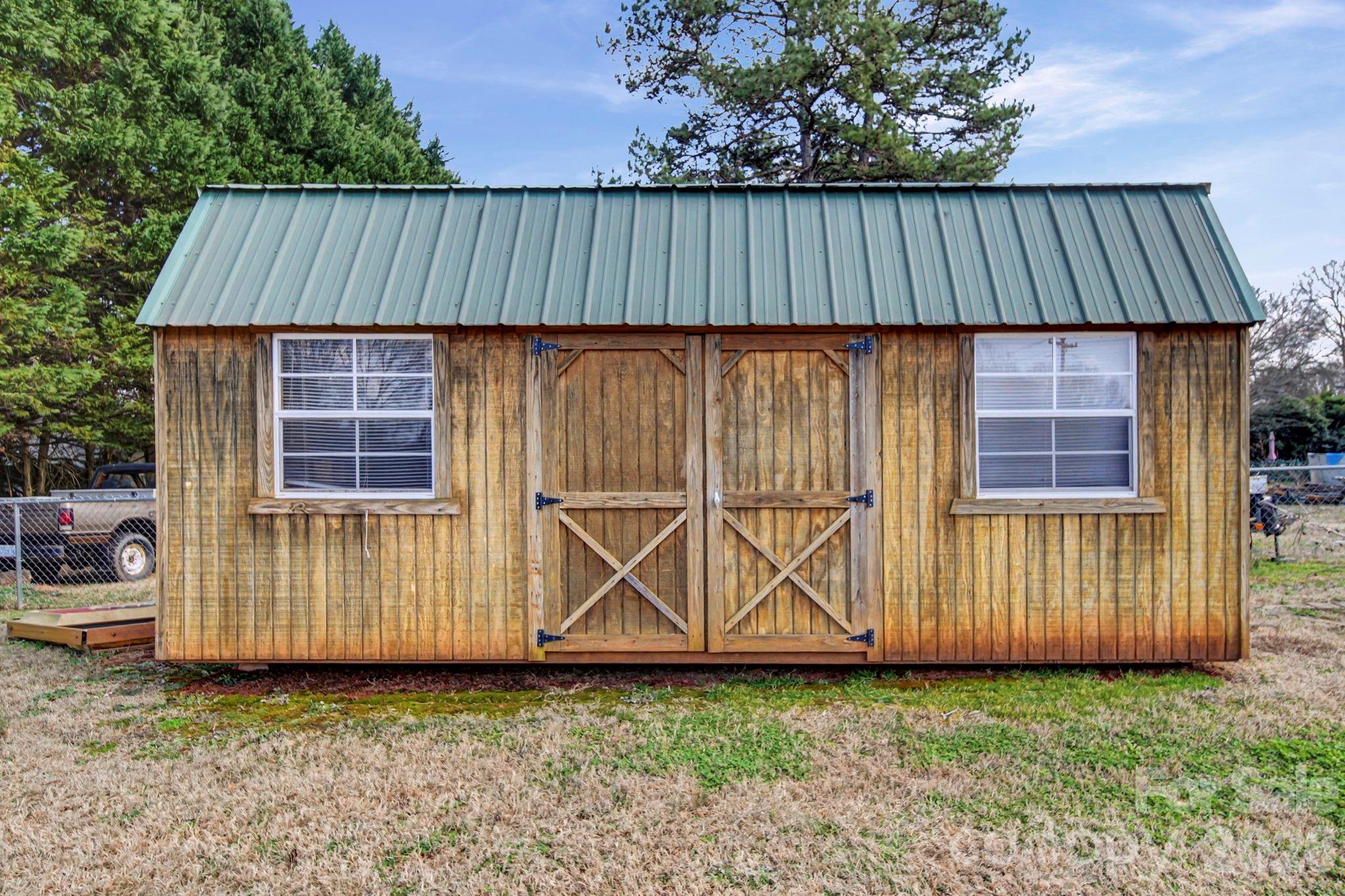 102 Roxie Lane Belmont, NC 28012 - Photo 25 of 26 a view of a backyard with wooden fence