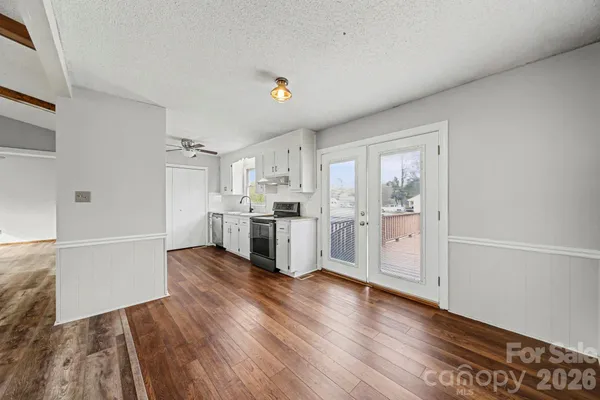 a view of kitchen with wooden floor