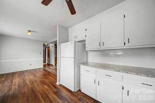 a kitchen with appliances and cabinets
