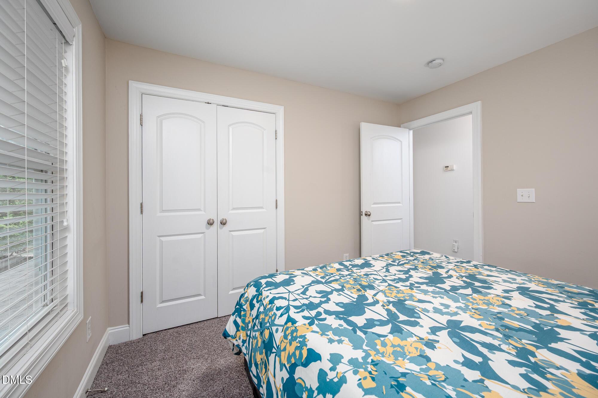 726 Ruth Circle Fuquay-Varina, NC 27526 - Photo 35 of 61 a bedroom with a bed and a painting on the wall