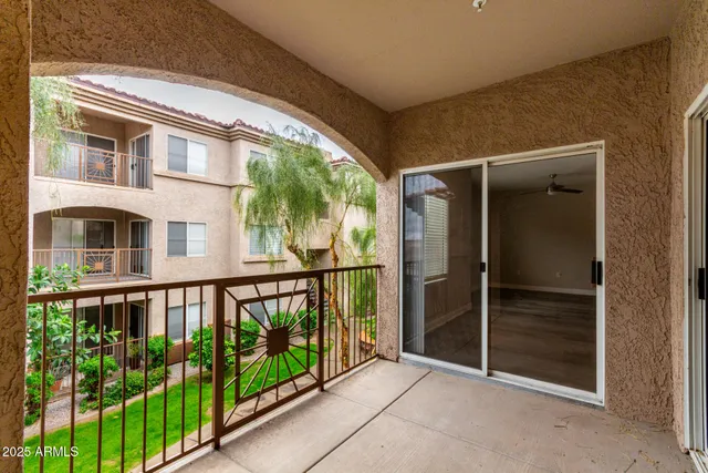 a view of a large building with a small yard