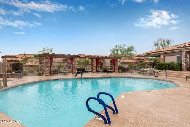 a front view of a house with a fountain