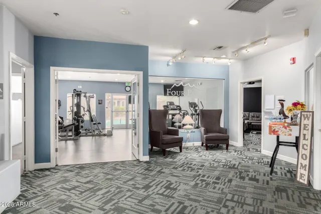 a swimming pool with outdoor seating and yard