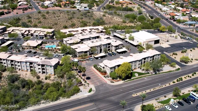 an aerial view of residential houses with outdoor space