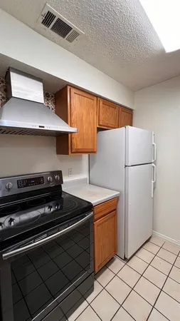 a kitchen with stainless steel appliances a refrigerator and a sink
