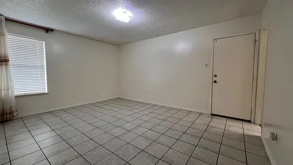 an empty room with white walls