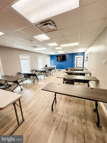 a room with lots of chairs and appliances
