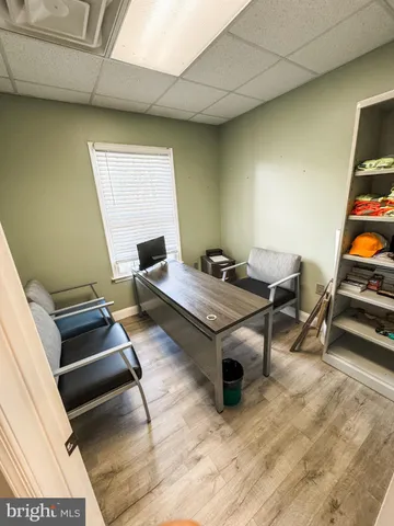 a living room with furniture a rug and a wooden floor