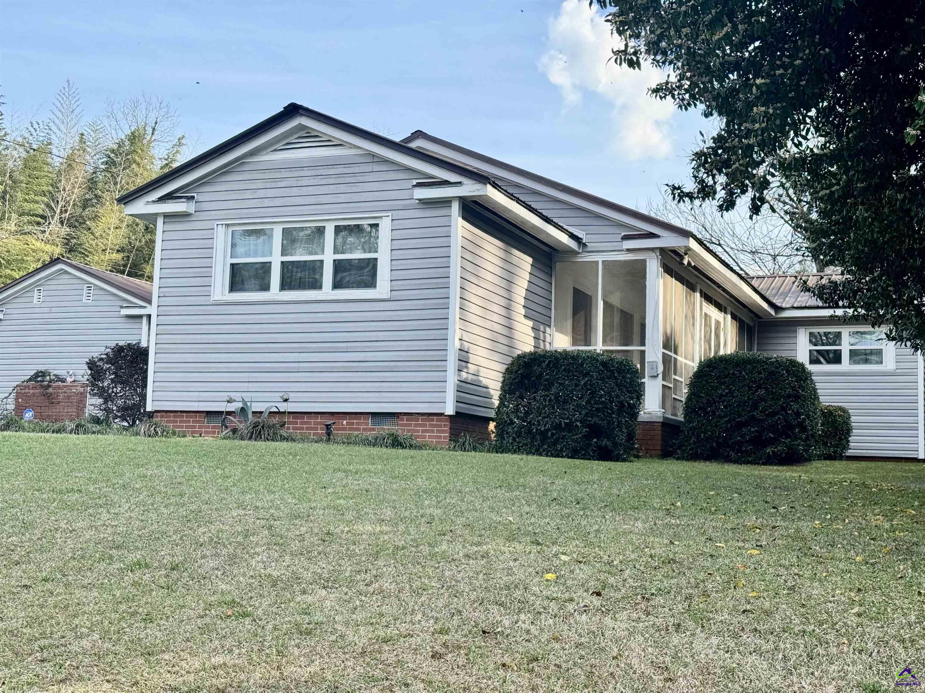 914 Adderton Street Americus, GA 31719 - Photo 3 of 53 a front view of a house with a yard
