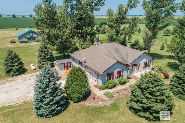an aerial view of a house with a yard