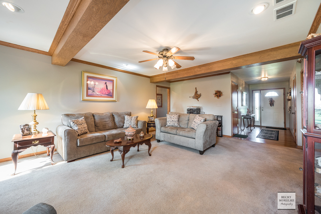5545 Nettle Creek Road Morris, IL 60450 - Photo 21 of 45 a living room with furniture and a chandelier