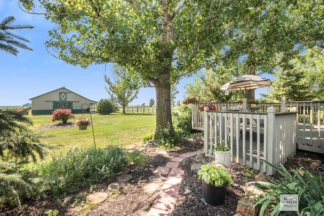 5545 Nettle Creek Road Morris, IL 60450 - Photo 5 of 45 a front view of a house with garden