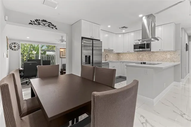 a backyard of a house with yard and outdoor seating