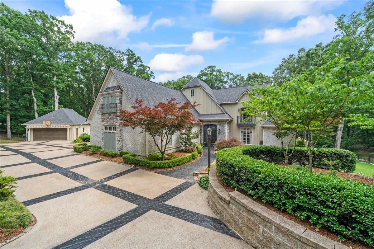 a front view of a house with garden