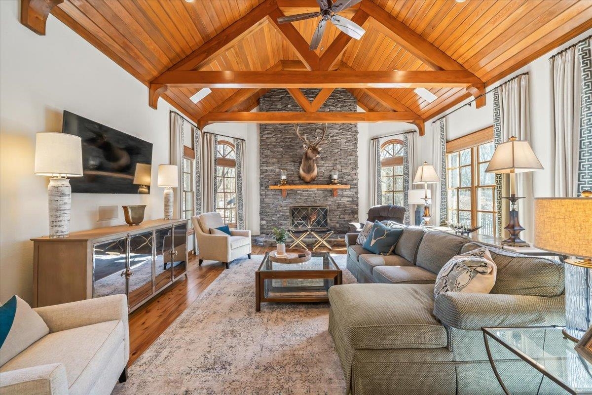 10951 Raleigh Lagrange Road East Eads, TN 38028 - Photo 11 of 40 a living room with furniture a flat screen tv and a chandelier