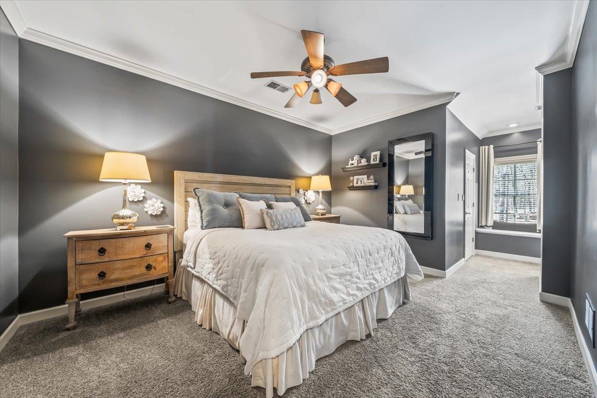 10951 Raleigh Lagrange Road East Eads, TN 38028 - Photo 14 of 40 a bedroom with a bed and a chandelier