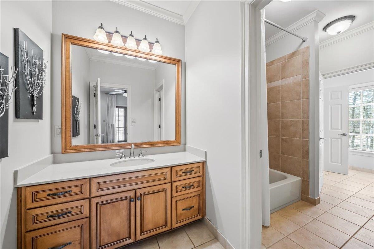 10951 Raleigh Lagrange Road East Eads, TN 38028 - Photo 15 of 40 a bathroom with a sink a mirror and a shower