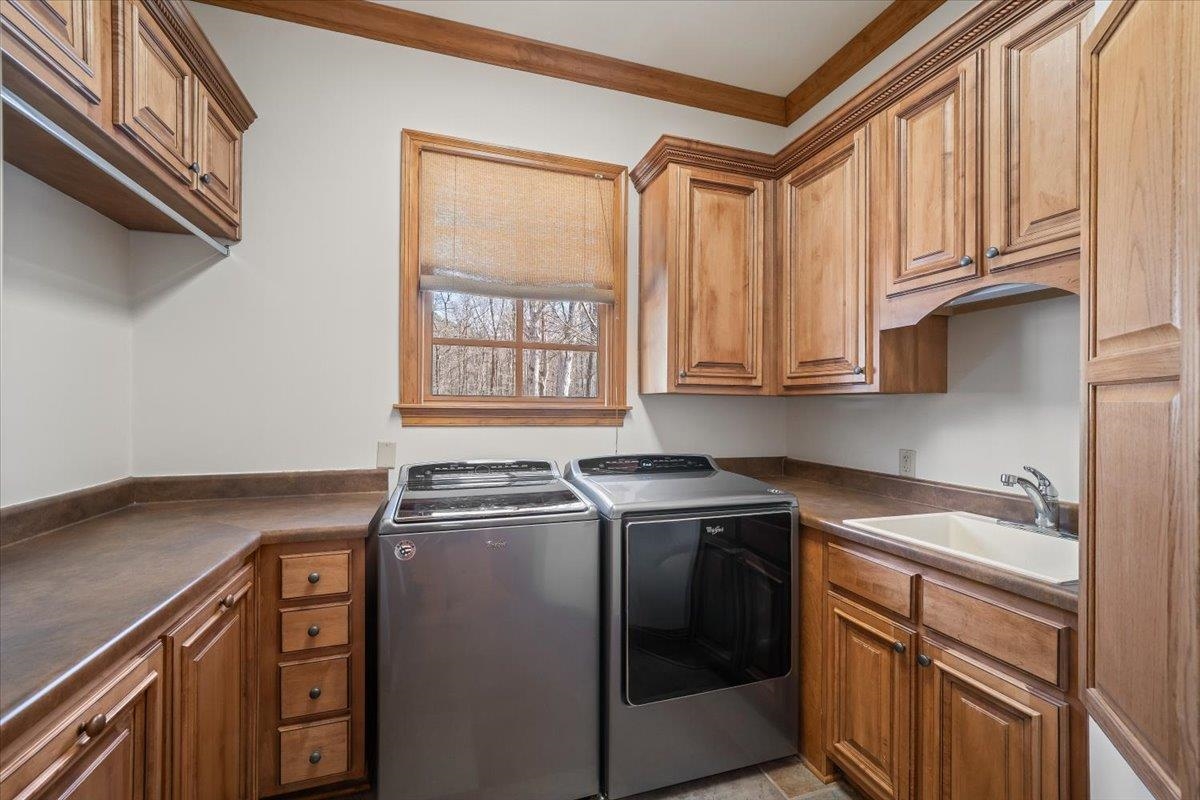 10951 Raleigh Lagrange Road East Eads, TN 38028 - Photo 18 of 40 a kitchen with stainless steel appliances granite countertop a sink a stove and a microwave oven with cabinets