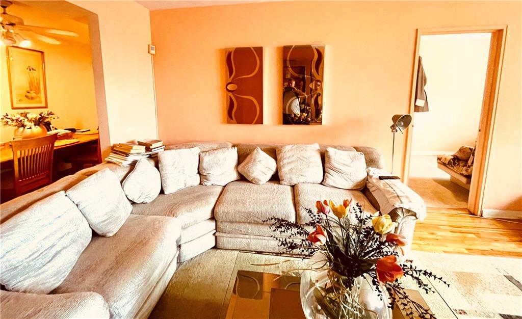 1200 Gravesend Neck Road, Unit 3B Brooklyn, NY 11229 - Photo 4 of 13 a bedroom with a bed and a chandelier