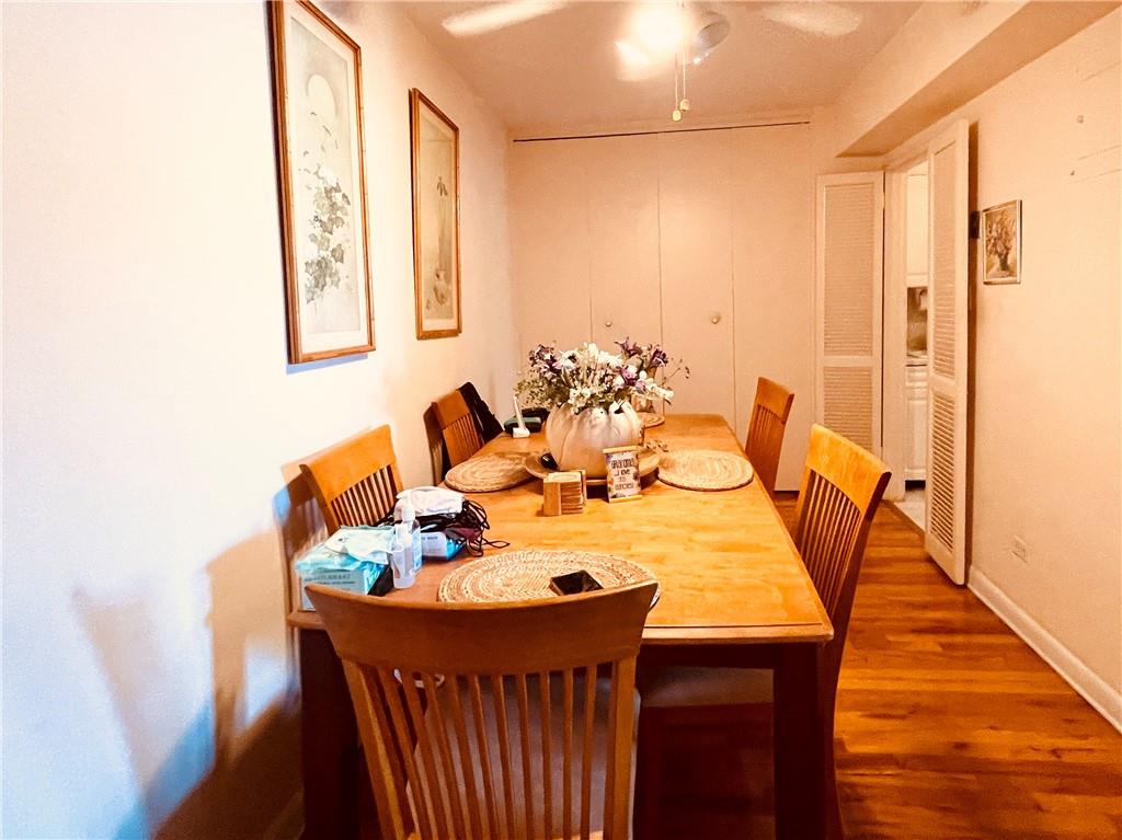 1200 Gravesend Neck Road, Unit 3B Brooklyn, NY 11229 - Photo 6 of 13 a view of a dining room with furniture and wooden floor