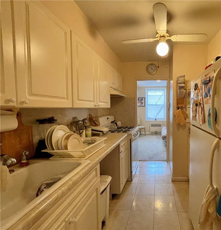 1200 Gravesend Neck Road, Unit 3B Brooklyn, NY 11229 - Photo 7 of 13 a kitchen with a sink and cabinets