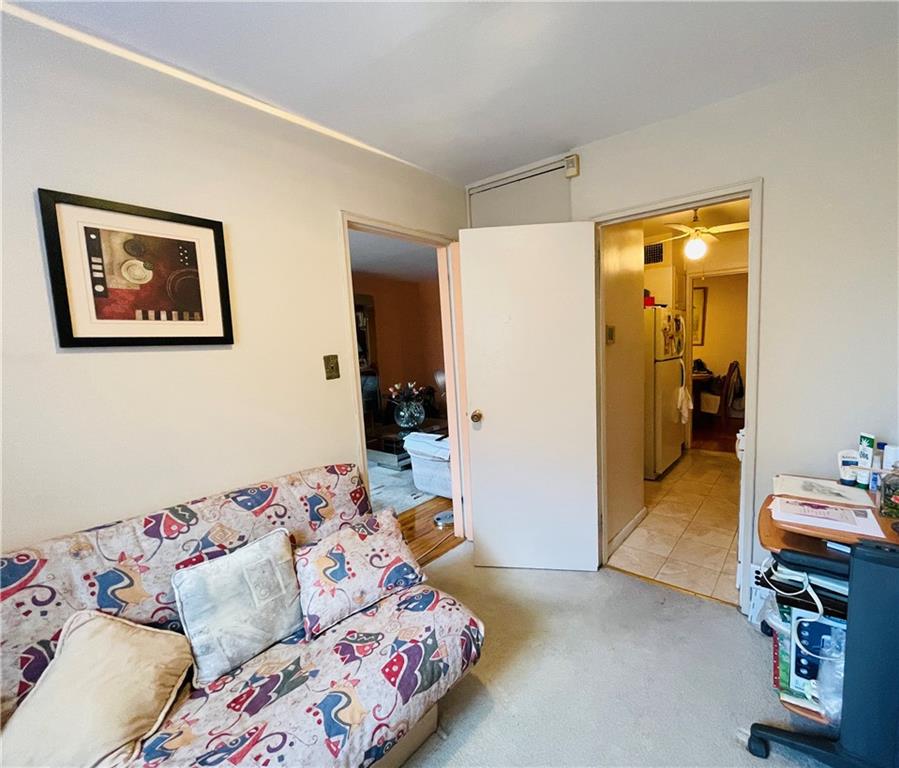 1200 Gravesend Neck Road, Unit 3B Brooklyn, NY 11229 - Photo 10 of 13 a bedroom with a bed and wooden floor