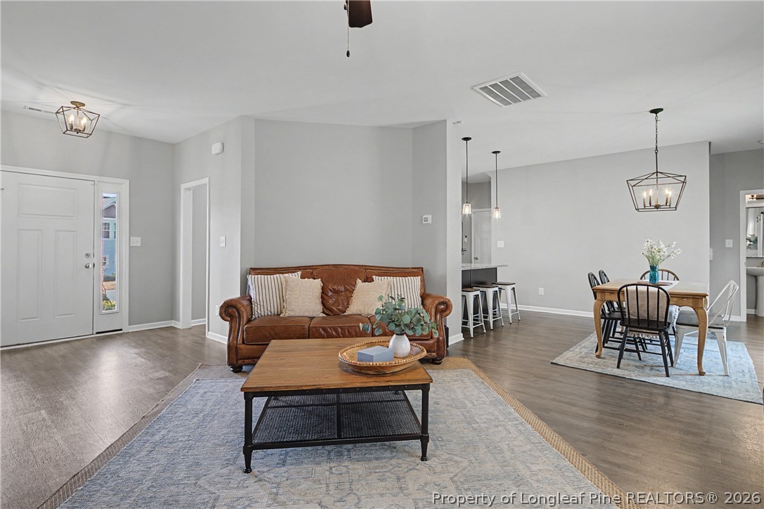 143 Ledgebrook Lane Raeford, NC 28376 - Photo 11 of 50 a living room with furniture and wooden floor